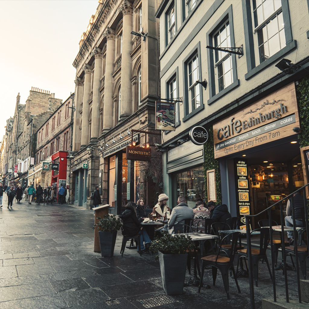 The dining room at Cafe Edinburgh: walnut floors, leather banquettes and candlelight